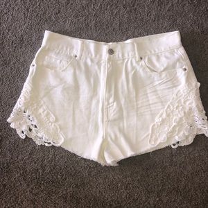 White high waisted shorts w/ lace on the sides